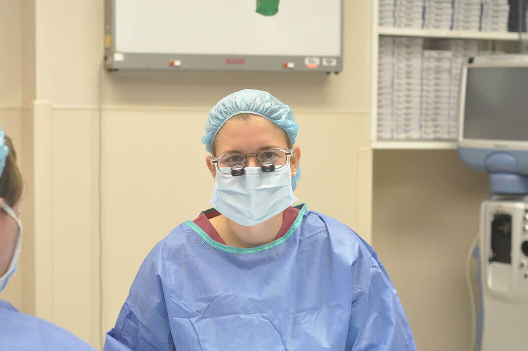 Eyelid surgeon working with patient