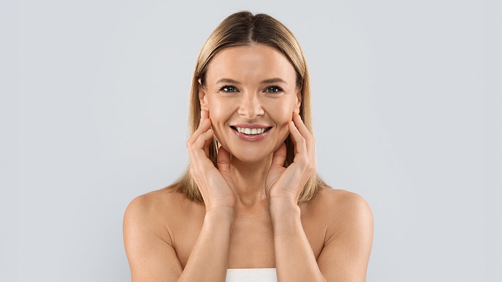 Smiling woman happy after her cosmetic surgery procedure